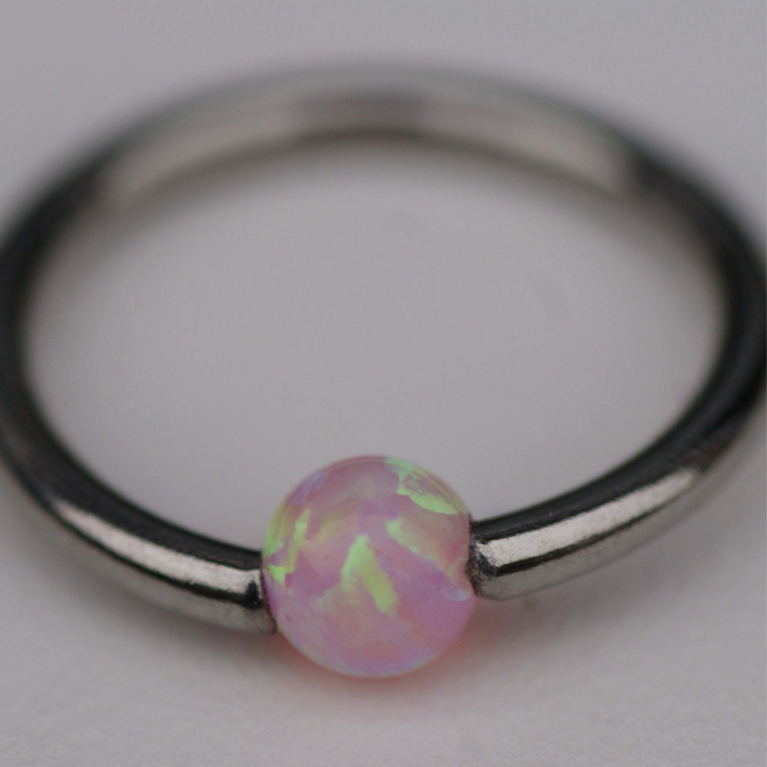 Opal captive clearance bead ring